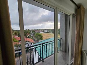 a view from the balcony of a condo at Arushi Luxury Residence in Kandana