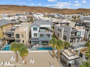 an aerial view of a residential neighborhood with palm trees at Deja Blue at Desert Color by Ember Stays in St. George
