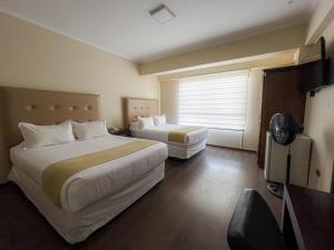 Postel nebo postele na pokoji v ubytování Domani Hotel Boutique