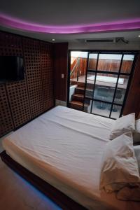 Ένα ή περισσότερα κρεβάτια σε δωμάτιο στο Motel Desejo Mossoró