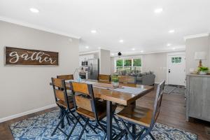 a dining room and kitchen with a table and chairs at Nordin's LakeHouse, Lakefront Hideaway on Delaware Bay Sleeps 10 in Dardanelle +25 photos