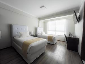 Postel nebo postele na pokoji v ubytování Domani Hotel Boutique
