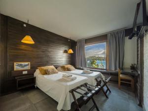 Postel nebo postele na pokoji v ubytování Hosteria Santa Rita