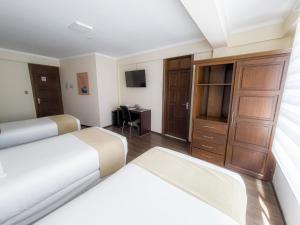 Postel nebo postele na pokoji v ubytování Domani Hotel Boutique