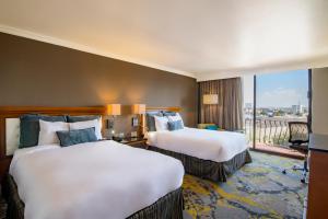Postel nebo postele na pokoji v ubytování Hotel Lucerna Ciudad Juarez