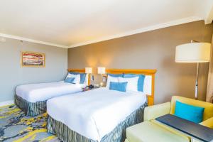 Postel nebo postele na pokoji v ubytování Hotel Lucerna Ciudad Juarez