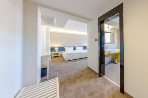 Postel nebo postele na pokoji v ubytování Hotel Studio
