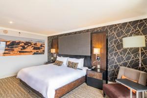 Postel nebo postele na pokoji v ubytování Hotel Lucerna Ciudad Juarez