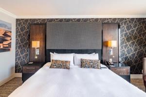 Postel nebo postele na pokoji v ubytování Hotel Lucerna Ciudad Juarez