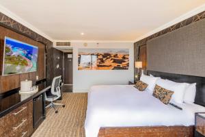 TV a/nebo společenská místnost v ubytování Hotel Lucerna Ciudad Juarez