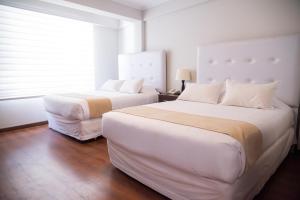 Postel nebo postele na pokoji v ubytování Domani Hotel Boutique