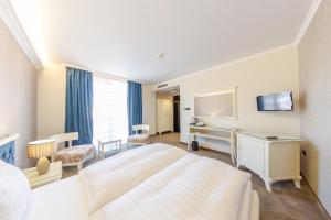 Postel nebo postele na pokoji v ubytování Hotel Studio