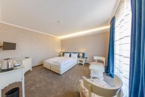 Postel nebo postele na pokoji v ubytování Hotel Studio