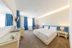 Postel nebo postele na pokoji v ubytování Hotel Studio