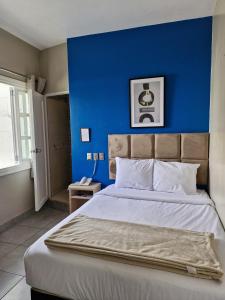 Cama ou camas em um quarto em Hotel Residencial Alfa