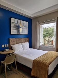 Cama ou camas em um quarto em Hotel Residencial Alfa