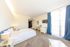 Postel nebo postele na pokoji v ubytování Hotel Studio