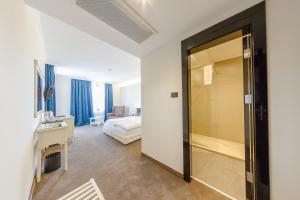 Postel nebo postele na pokoji v ubytování Hotel Studio