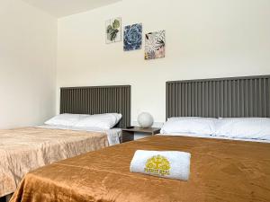 Postel nebo postele na pokoji v ubytování Hotel Fuente Real Popayán