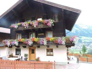 a building with flower boxes on the side of it at Haslinggut in Bad Hofgastein