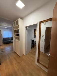 a room with a mirror and a living room at Ferienwohnung-Montagewohnung 1 in Paderborn