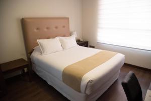 Postel nebo postele na pokoji v ubytování Domani Hotel Boutique