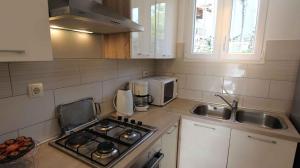 Køkken eller tekøkken på Apartment in Malinska 40