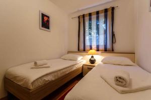 Postel nebo postele na pokoji v ubytování Malinska Apartment 15