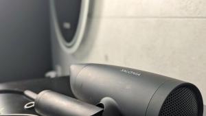 a hair dryer sitting on top of a table at Yonagunijima Hotel Munbu Stay Kukomae - Vacation STAY 87337v in Sonai