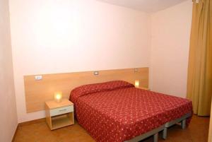 Łóżko lub łóżka w pokoju w obiekcie Residenza San Rocco