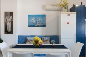 a dining room table with a bowl of fruit on it at Serfanto house - Serifos in Livadion