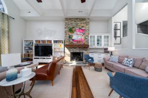 a living room with a couch and a fireplace at 2251 Catesby's Bluff in Seabrook Island