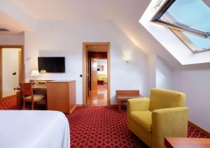 TV a/nebo společenská místnost v ubytování Hotel Zentral León