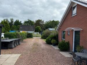 Κήπος έξω από το 5 persoons vakantiewoning Robbenoort 50 Lauwersoog