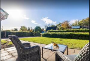 Κήπος έξω από το 5 persoons vakantiewoning Robbenoort 50 Lauwersoog