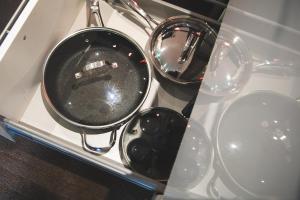 a pot sitting on a stove with other pots and pans at KingstonStays Spacious Historic Downtown Stableman's House Loft in Kingston