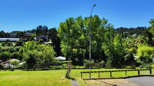 a park with a fence and a street light at Depto Playa Pto Montt Pelluco in Puerto Montt