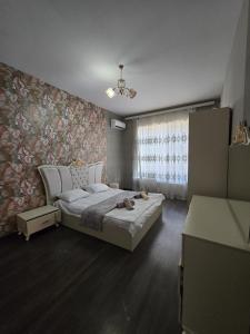 Postel nebo postele na pokoji v ubytování White House Villa