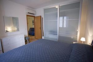 A bed or beds in a room at Appartamenti Bilo Sofi