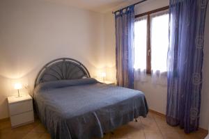 A bed or beds in a room at Appartamenti Bilo Sofi