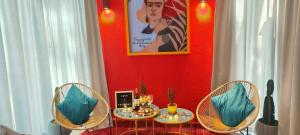 a dining room with two tables and two chairs at Glamping Raíces in Manizales
