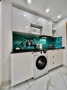 Kuchyň nebo kuchyňský kout v ubytování Elegante Apartamento TRES COLORES