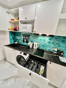 Kuchyň nebo kuchyňský kout v ubytování Elegante Apartamento TRES COLORES