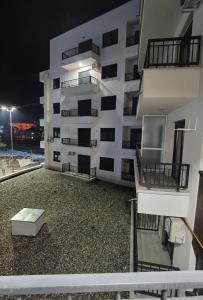 a balcony of a apartment building at night at Pavlovic Luxury Spa in Vrnjačka Banja