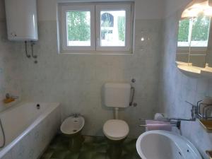 Kúpeľňa v ubytovaní Apartments Sunset + 25 fotografií