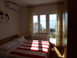 Posteľ alebo postele v izbe v ubytovaní Apartments Sunset