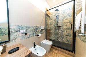a bathroom with a shower and a toilet and a sink at Front Stays Numidio Quadrato in Rome