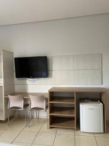 TV a/nebo společenská místnost v ubytování Hotel Comaxin