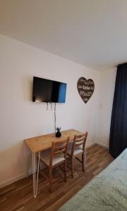 TV a/nebo společenská místnost v ubytování Vilnius Apart Suite