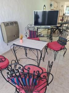 Televiisor ja/või meelelahutuskeskus majutusasutuses Duplex 4pax Playa Unión